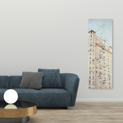 Canvas 20 x 60 - Birds flying in front of a building