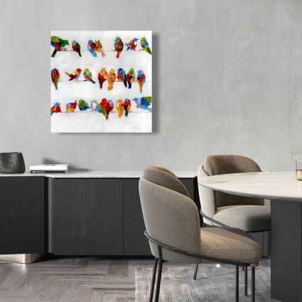 Beaucoup d'oiseaux colorés sur un fil