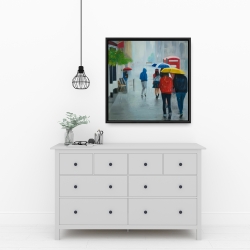Framed 24 x 24 - People walking under umbrella by a rainy day