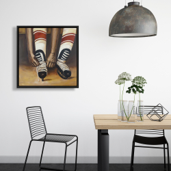 Framed 24 x 24 - Hockey player ties his skates