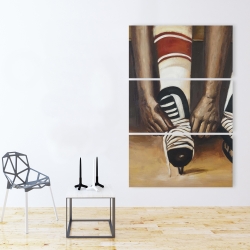 Canvas 40 x 60 - Hockey player ties his skates