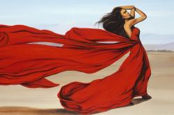  femme avec longue robe rouge dans le désert