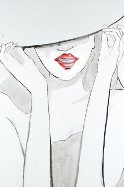 Femme avec grand chapeau
