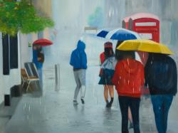People walking under umbrella by a rainy day
