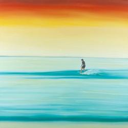 Un surfeur à l'aube