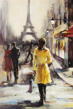 Yellow coat woman walking on the street