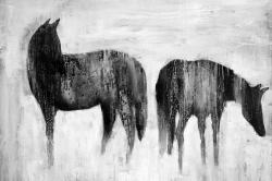 Horses silhouettes in the mist