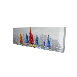 Bateaux colorés près d'une ville grise