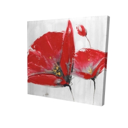 Three red flowers on gray background
