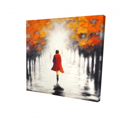 Femme avec un manteau rouge en automne