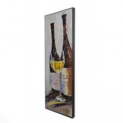 Two bottles with a glass of white wine