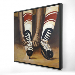 Hockey player ties his skates