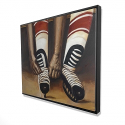 Hockey player ties his skates