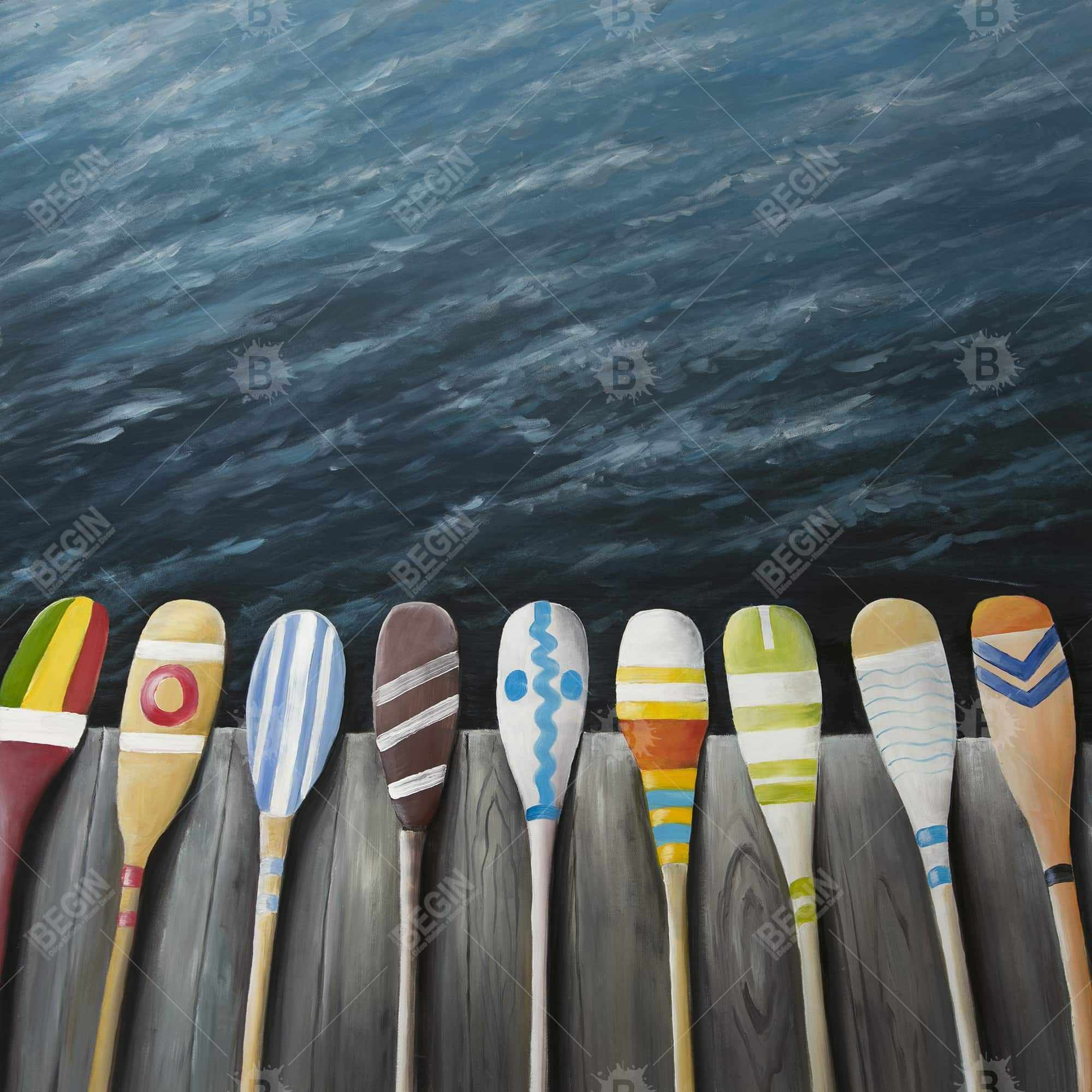 Colorful paddles on the dock